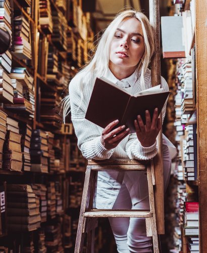 blonde-and-pretty-woman-in-white-sweater-reading-b-2023-11-27-05-01-27-utc-2 copy